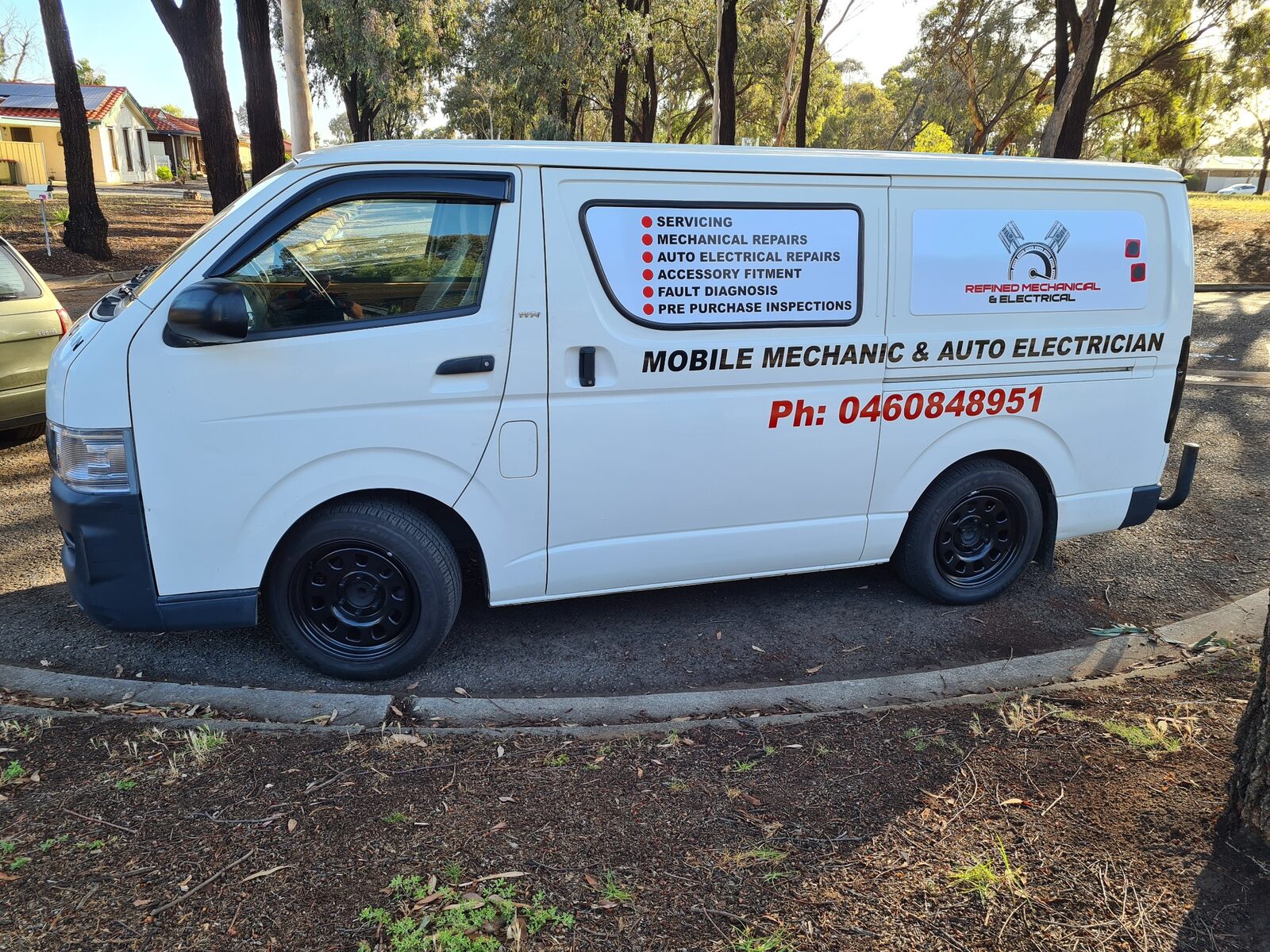 White van with mechanical business signage